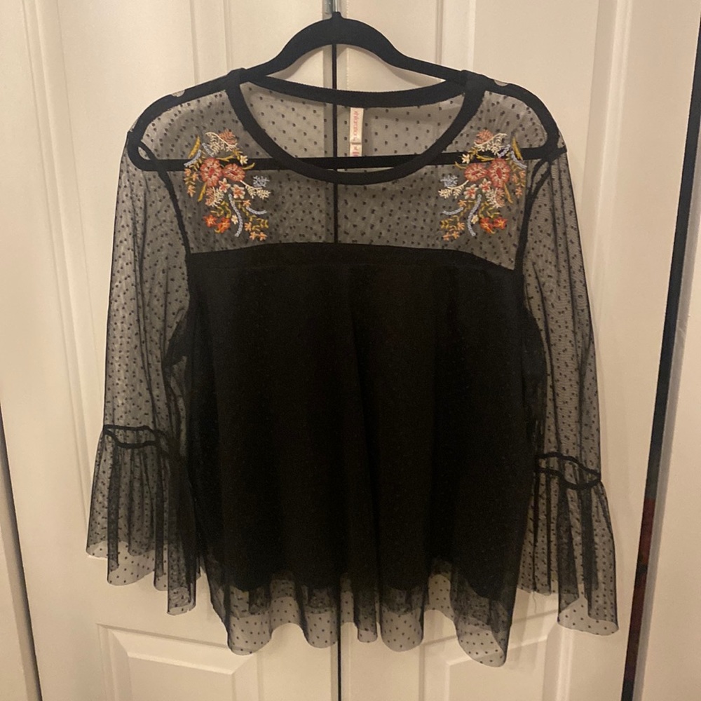 Black sheer top with polka dot pattern and embroidered detail